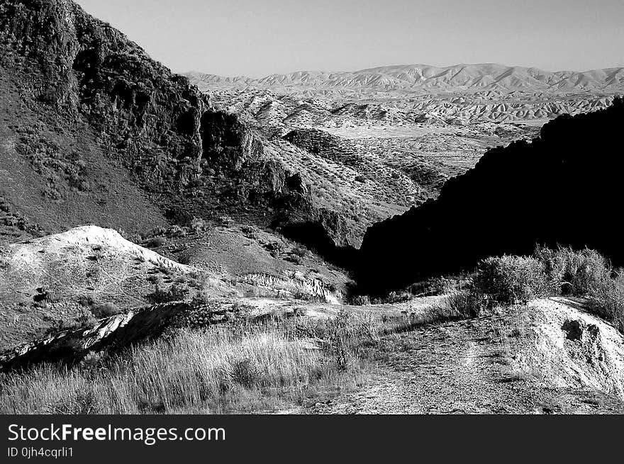 Grayscale Photo of Mountain Range