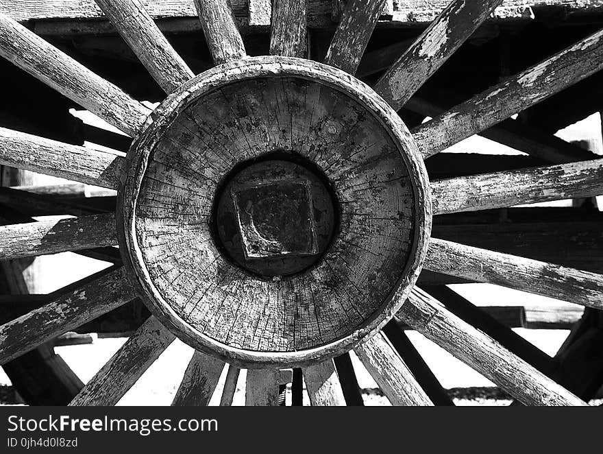 Grayscale Photography of Carriage Wheel