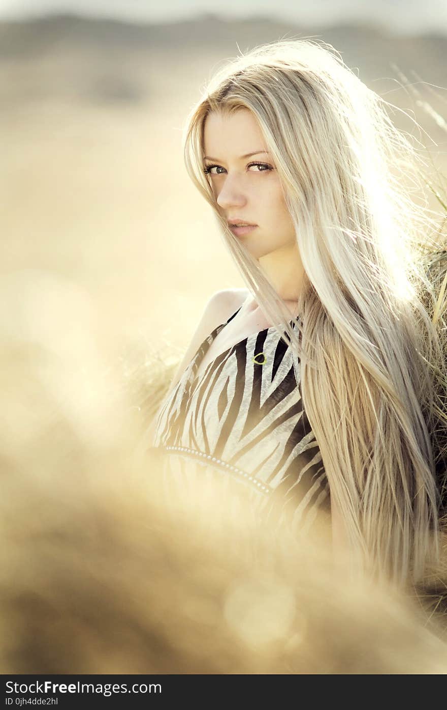 Blonde Haired Woman in Open Field Photoshoot during Daytime