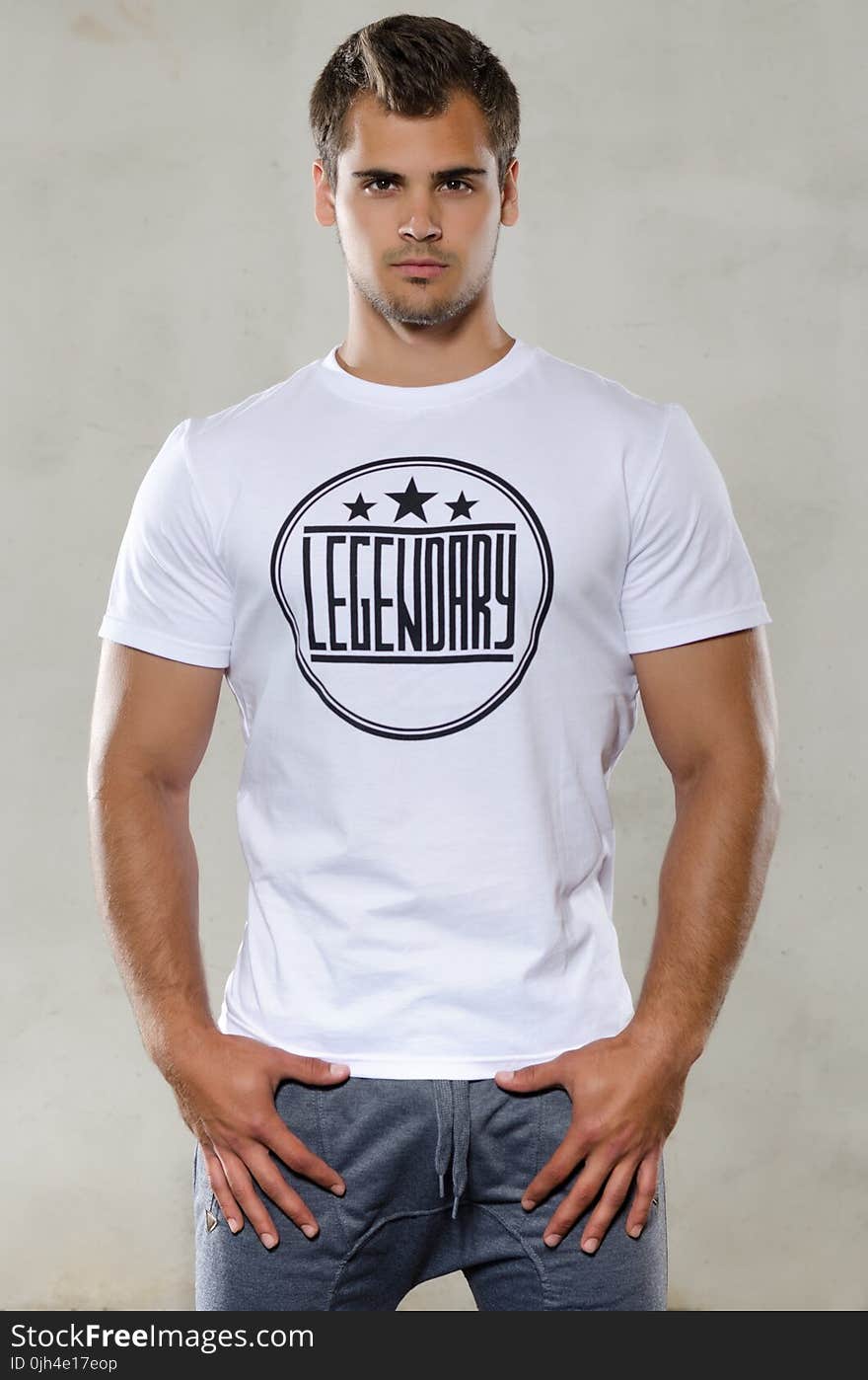 Man Wearing White and Black Legendary Print T-shirt