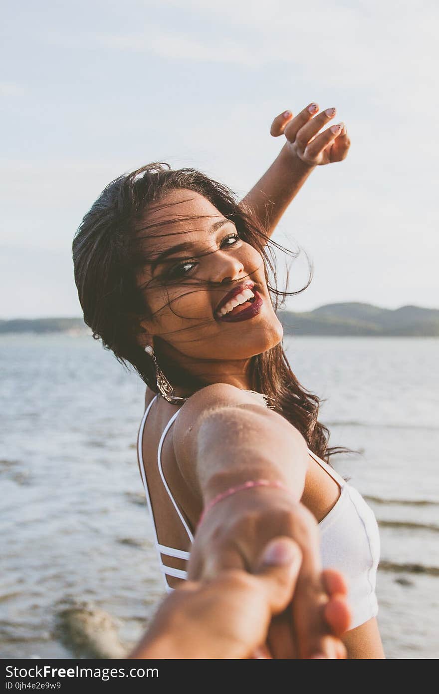 Woman Wearing White Bralet Near Seashore during Daytime