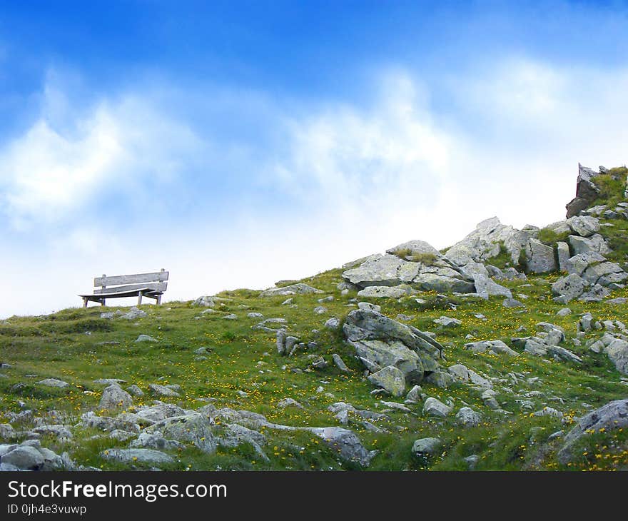 White Wooden Bench in Mountain during Daytime