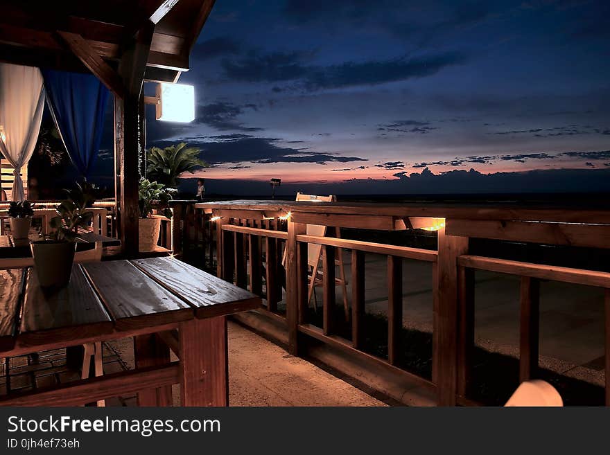 Vacant Tables and Chairs in the Balcony