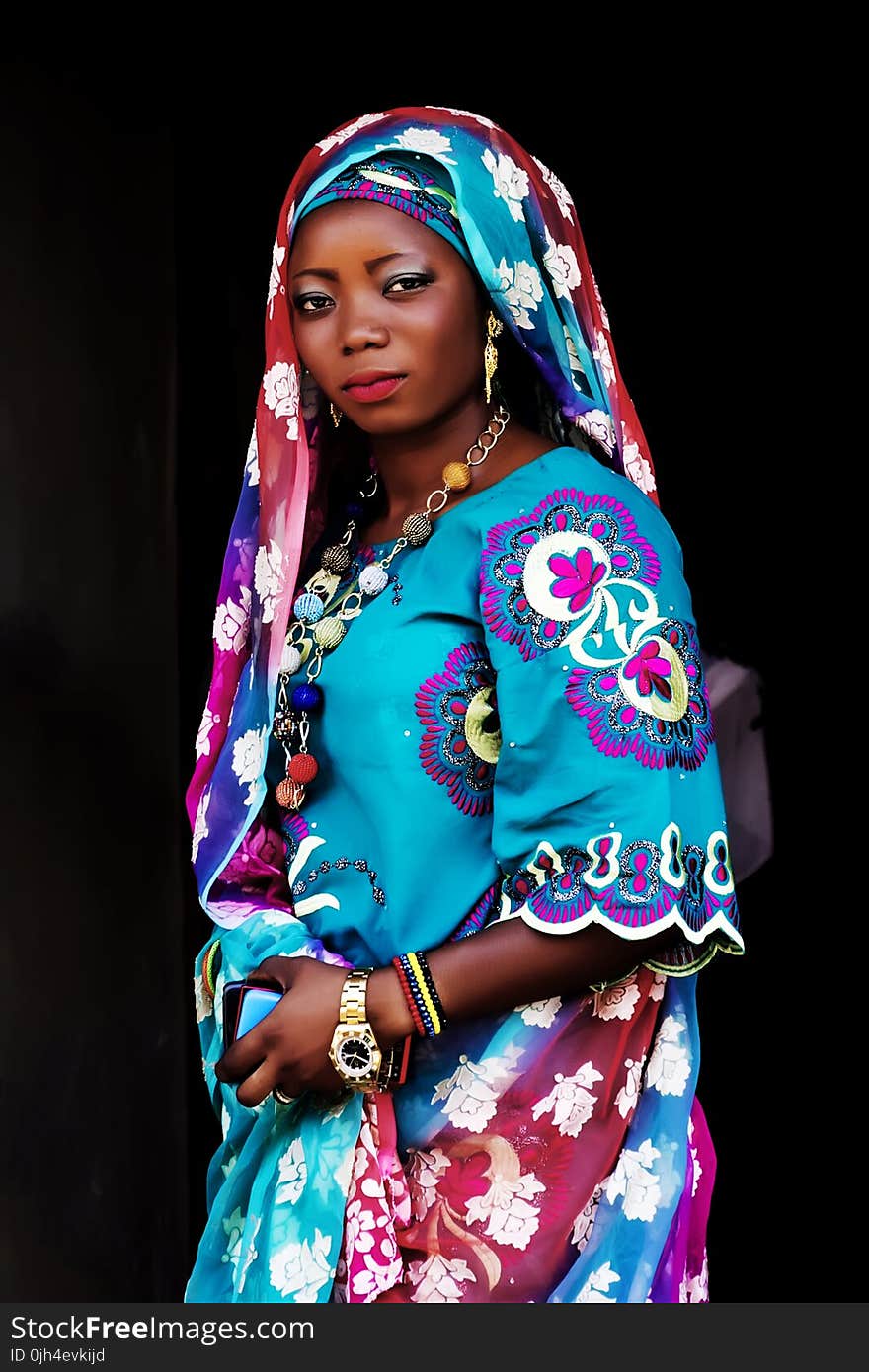 Woman in Blue Multicolored Floral Traditional Dress