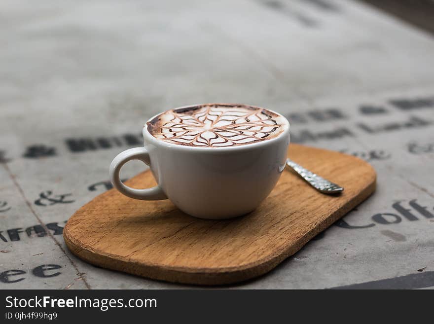 Cappuccino in Ceramic Teacup Beside Teaspoon