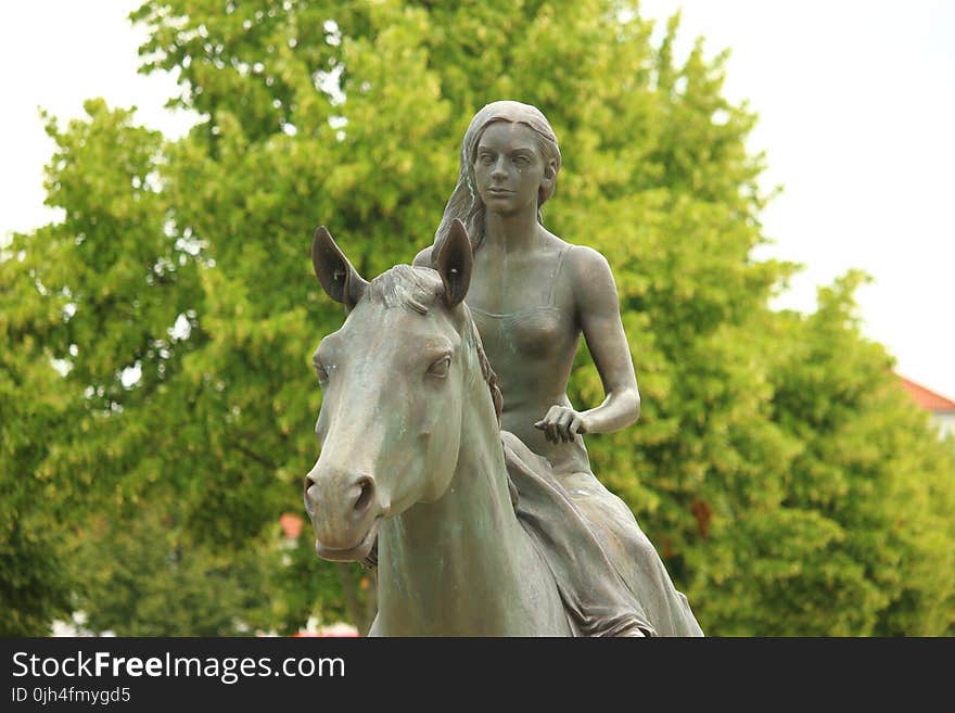 Woman Riding Horse Statue