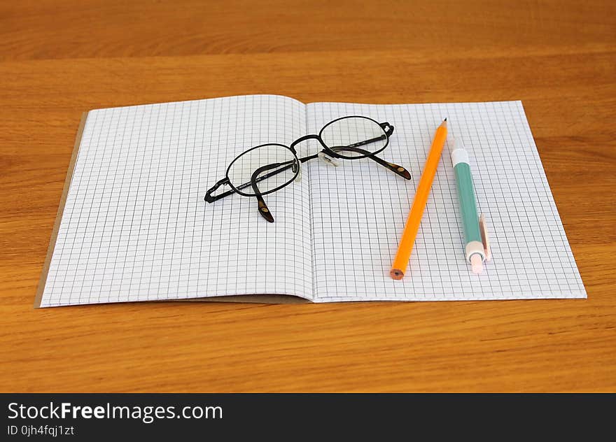 Black Framed Eyeglass on Graphing Paper