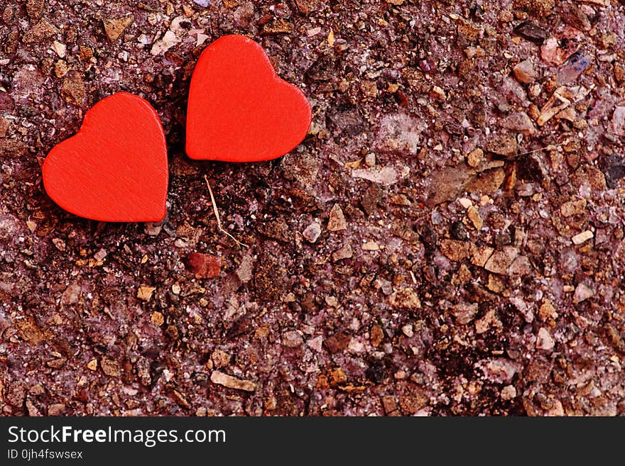 Two Red Heart Decoration on Ground