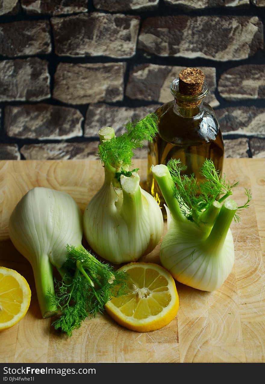 White Onion With Sliced Lemon on Beige Table