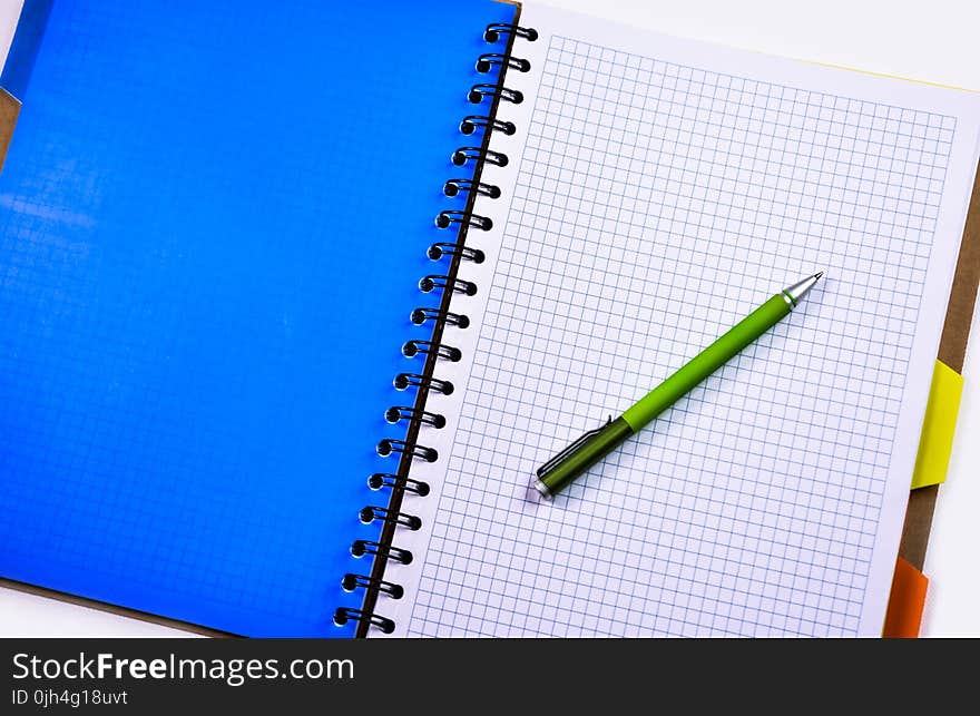 Green and Silver Push Pen on White Ruled Paper Indoors