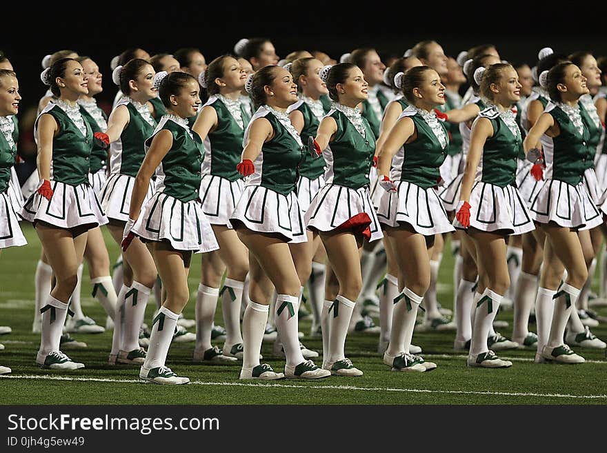 Group of Cheerleader on Green Field