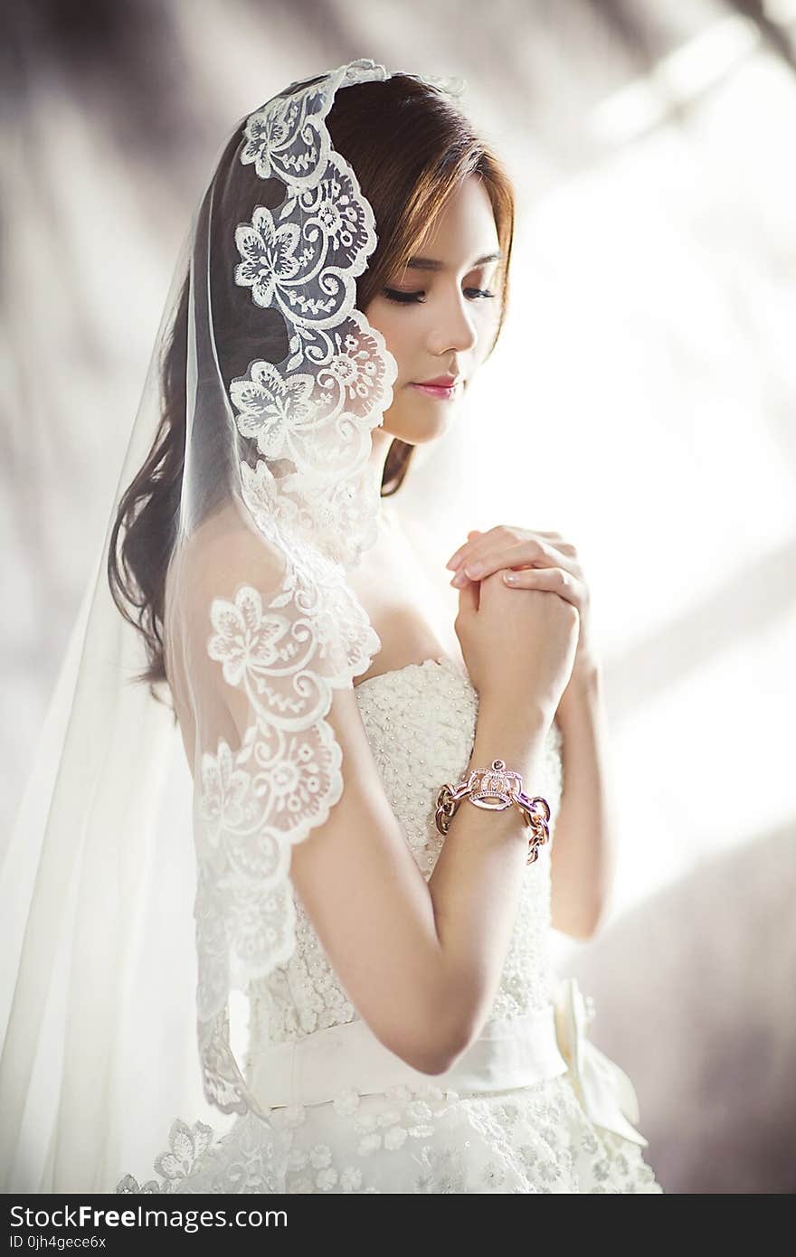 Woman in White Bridal Gown Meditating