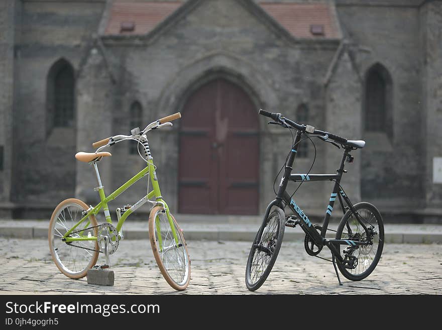 Green Bike Beside Black Bike