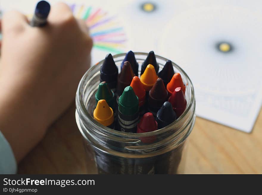 Multicolored Crayons Inside Clear Plastic Round Case