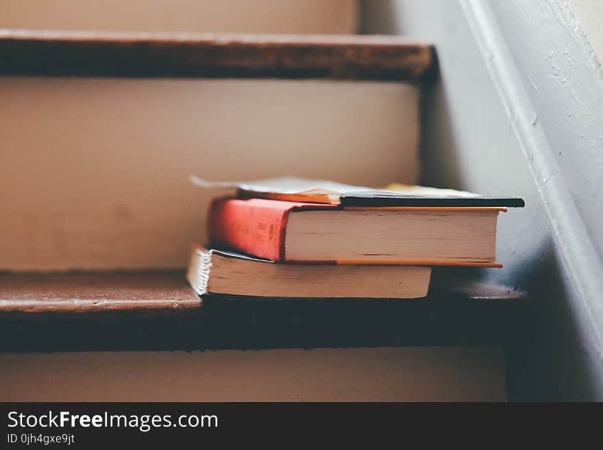 2 Book on Brown Wooden Stair