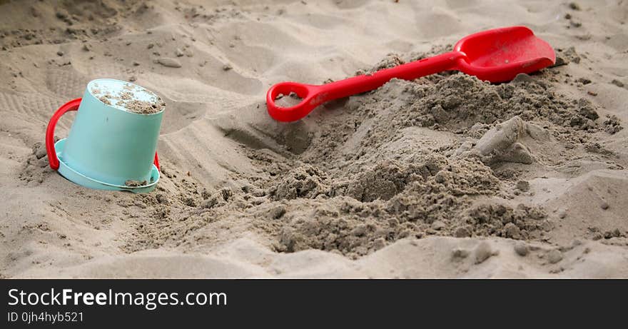 Teal Sand Pail Near Sand Shovel Toy