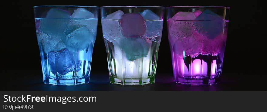 Blue White and Purple Beverage With Ice on Clear Drinking Glass