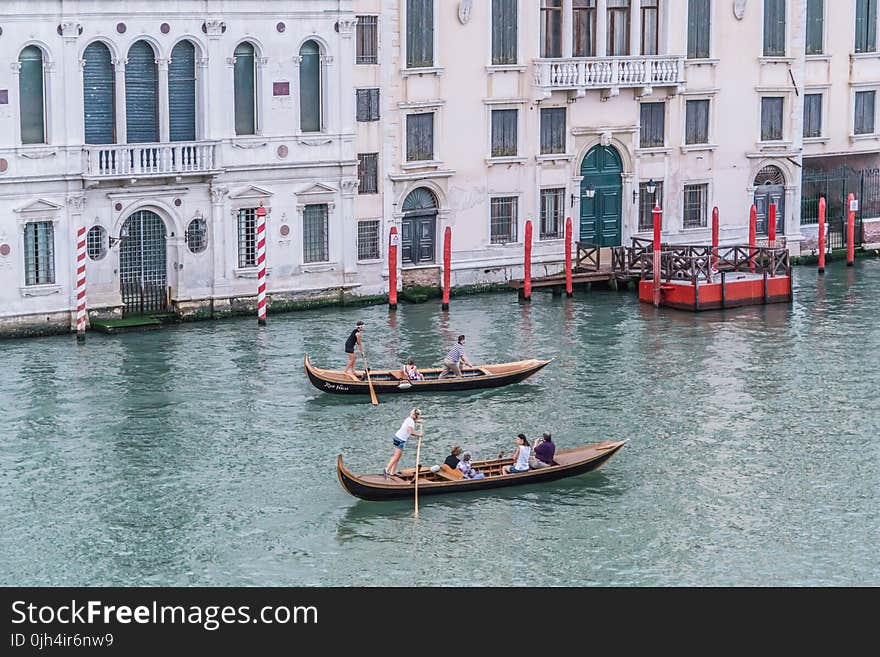 Green Canoe With People Inside