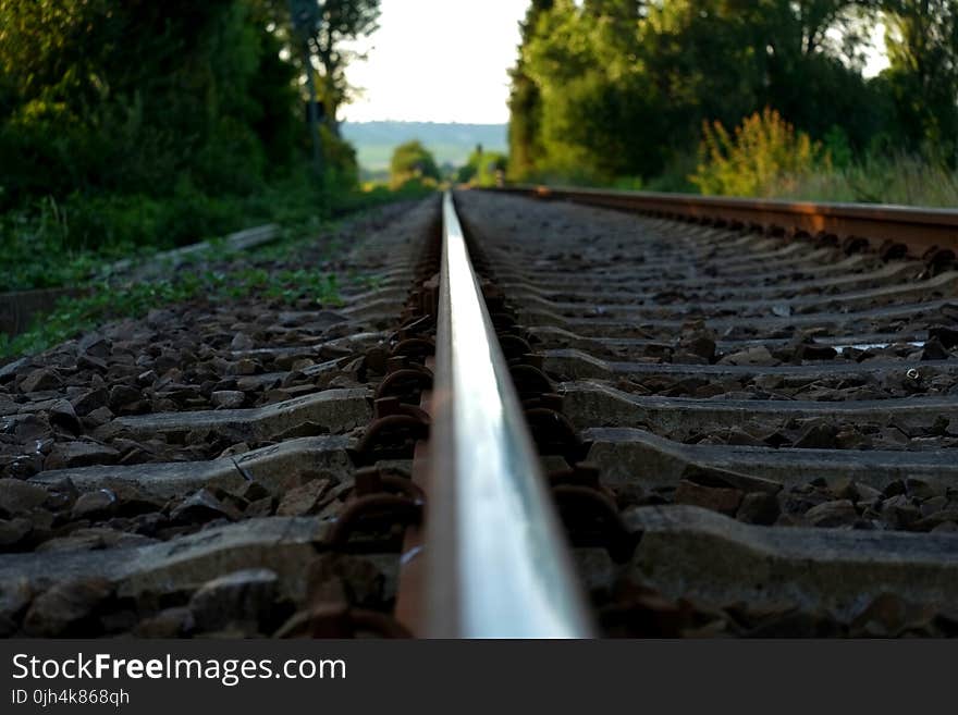 Brown Train Rail on Close Up Photo during Daytime