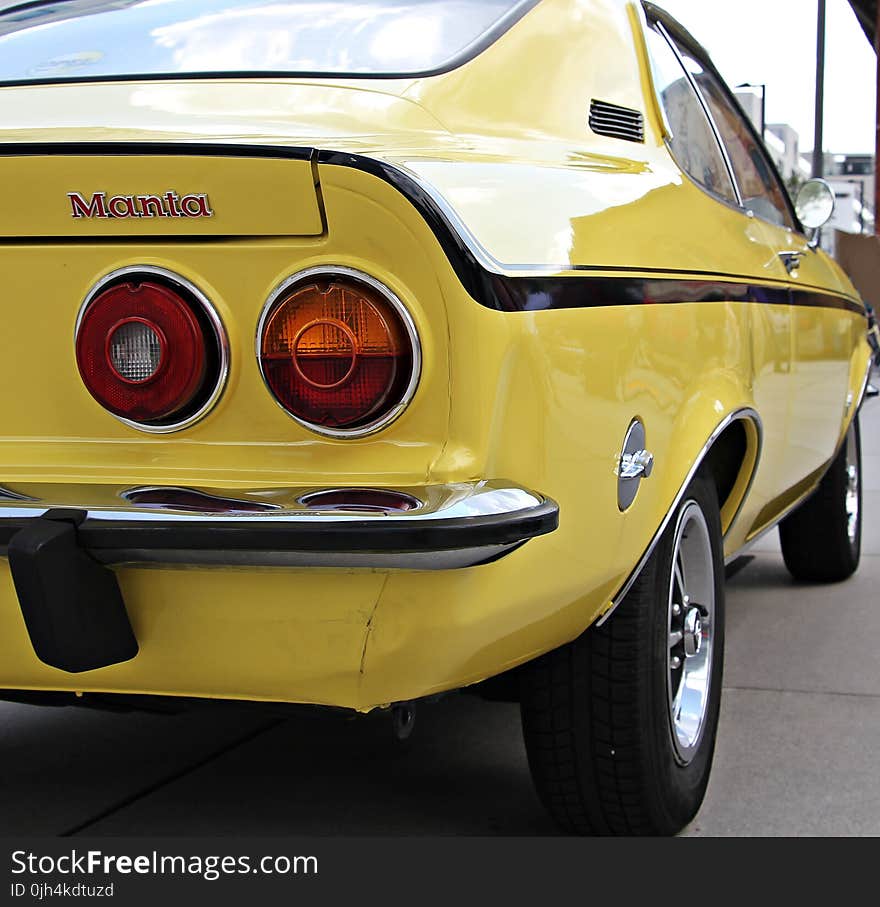 Yellow and Black Muscle Car Parked during Daytime