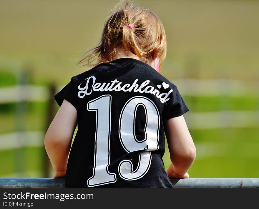 Girl Wearing Deutschland 19 Black T Shirt during Daytime