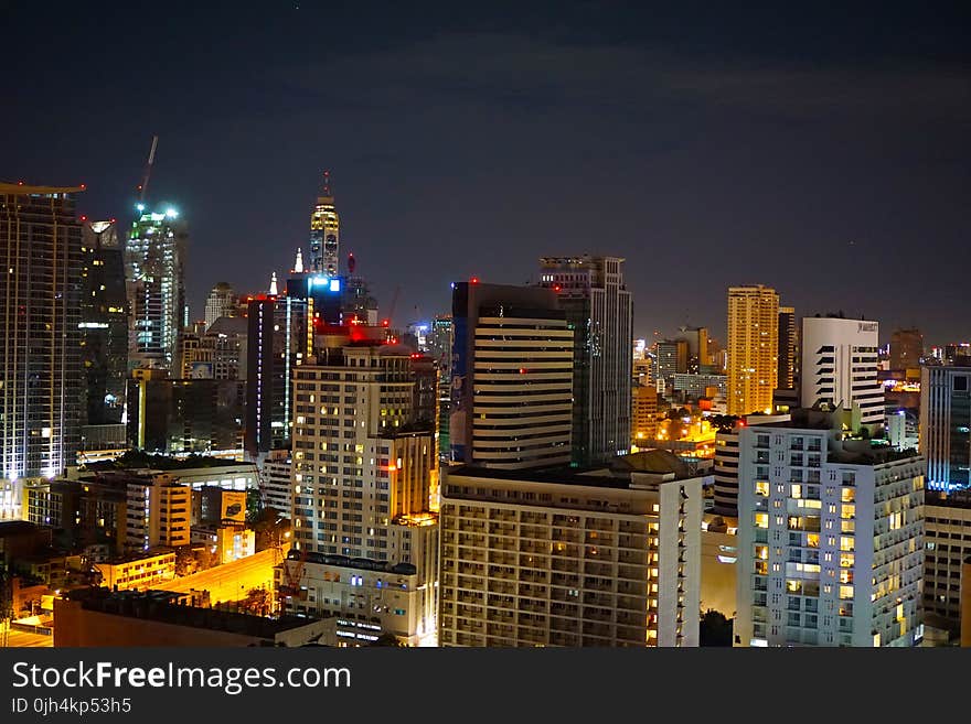 Concrete High Rise Building during Night Time