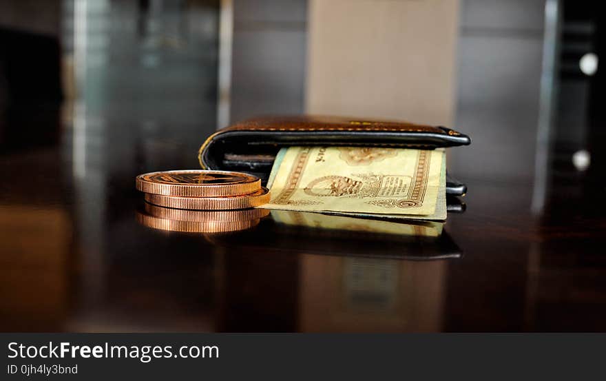 Brown Leather Bifold Wallet With Banknotes Sticking Out