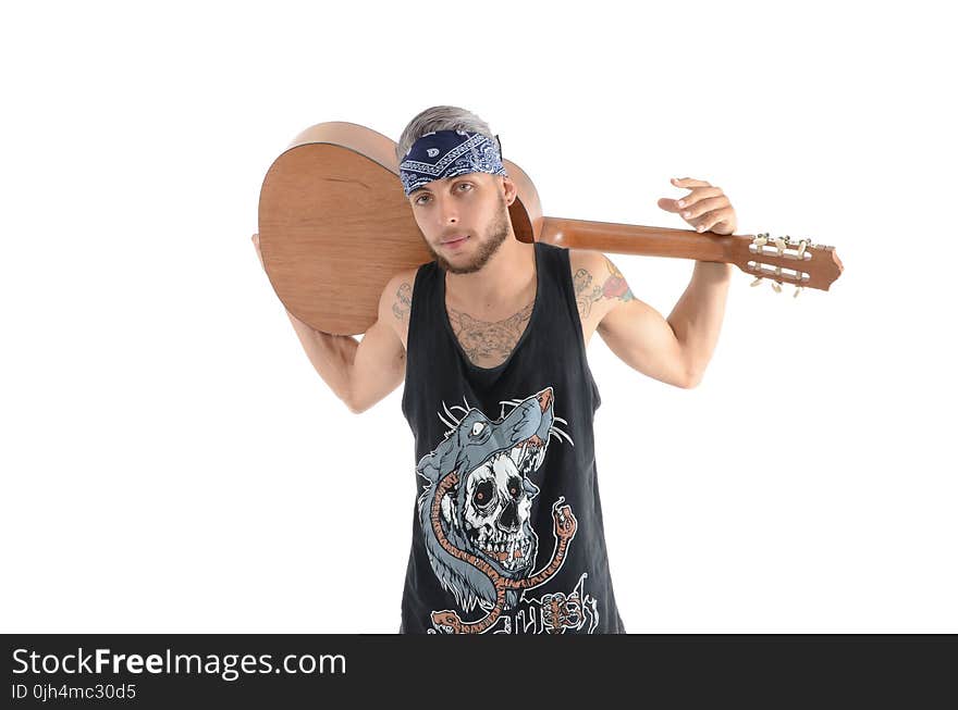 Man in Black and Grey Tank Top Carrying Brown Classical Guitar