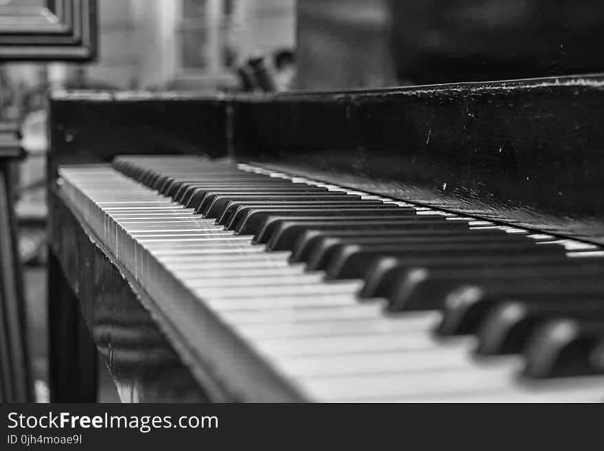 Close Up Shot of Upright Piano Grayscale Photo