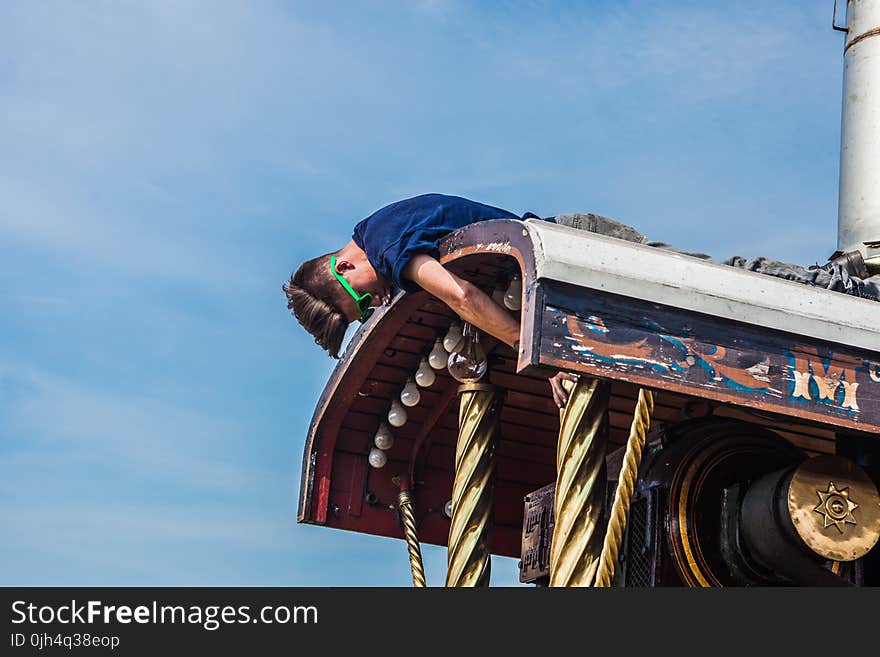 Man on Roof during Daytime