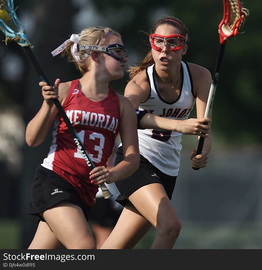 Woman and Girl Playing Lacrosse