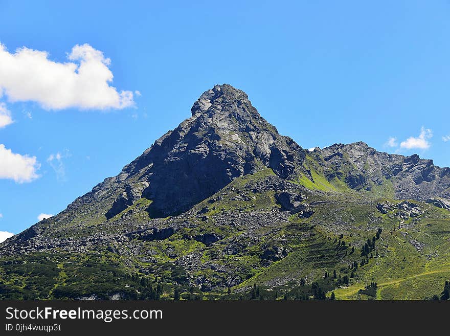 Gray Mountains Covered by Green Trees Under Clear Blue Sky and Clouds