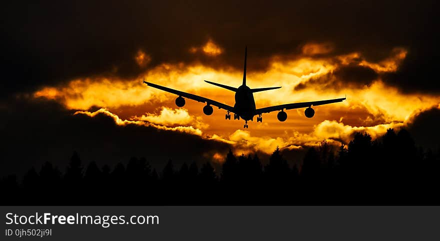 Airplane Silhouette on Air during Sunset