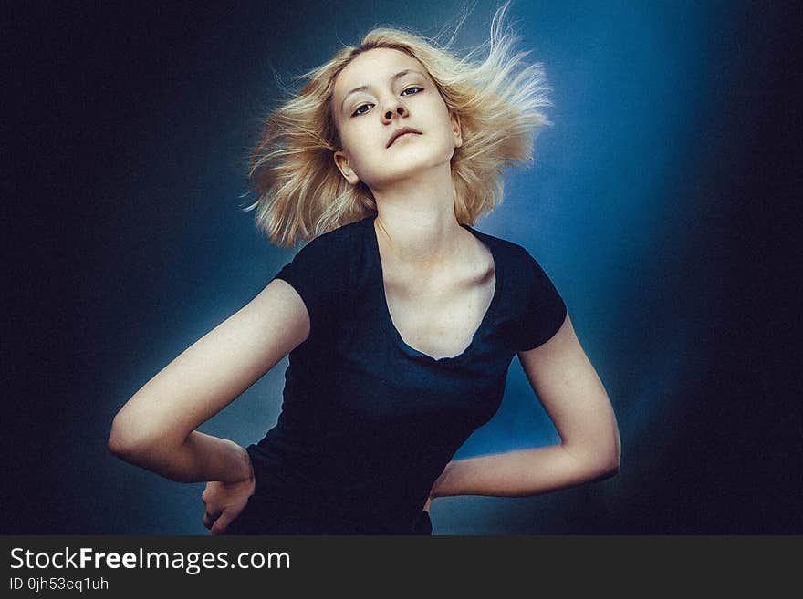 Blonde Haired Woman Wearing Black Scoop Neck Shirt