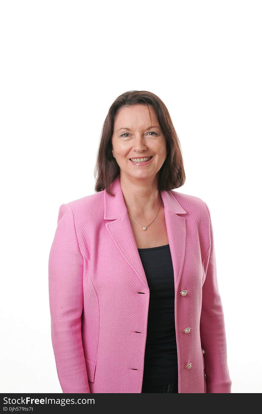 Smiling Woman Wearing Black Shirt and Pink Button Up Blazer