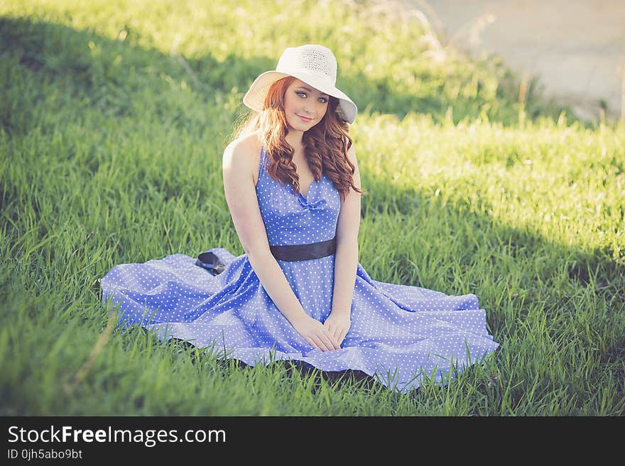 Portrait of a Smiling Young Woman in Grass