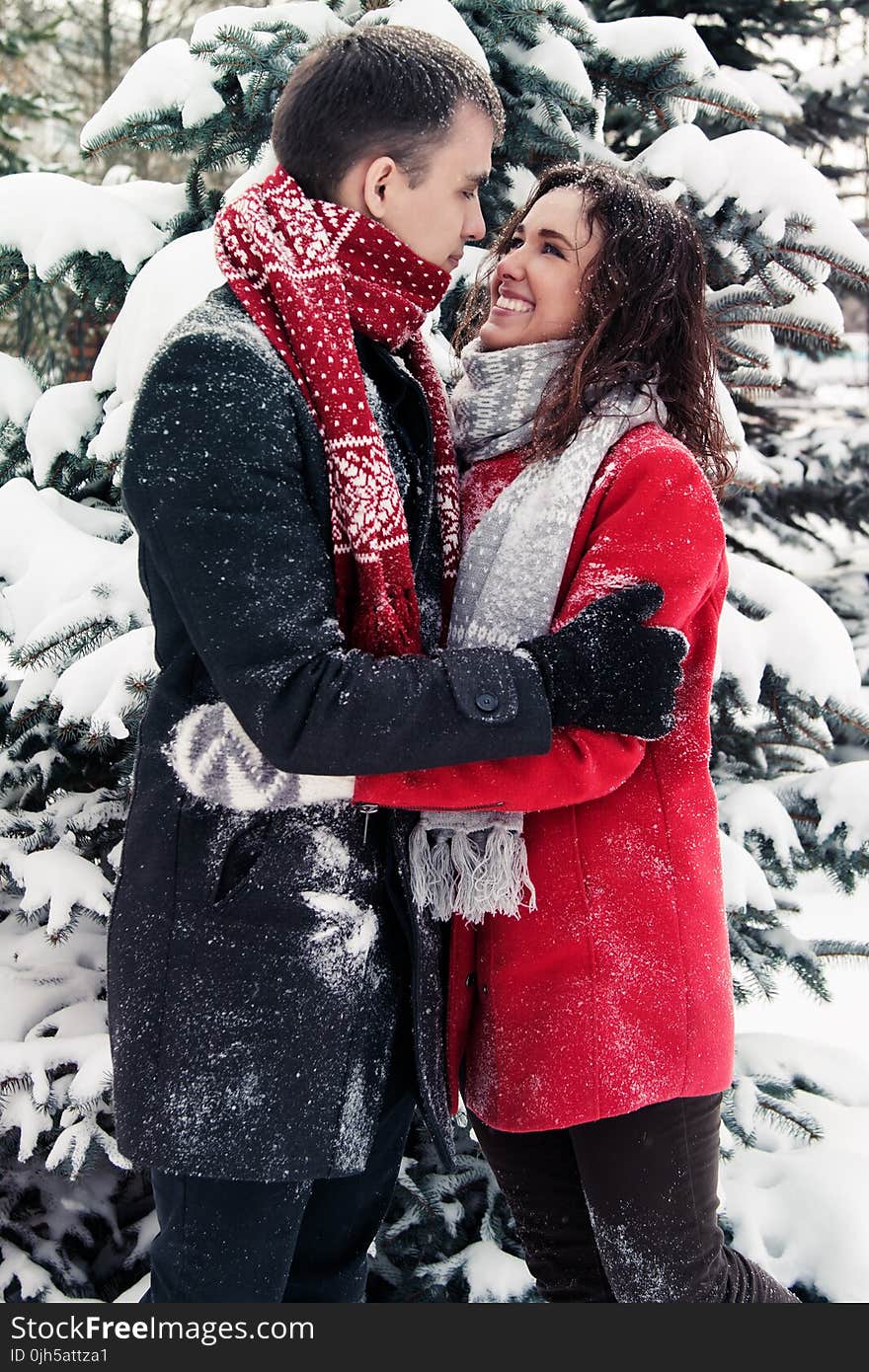 Full Length of Happy Friends in Snow on Field