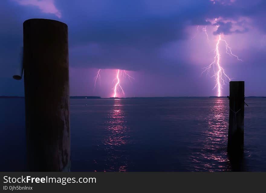 Lightning over Sea Against Storm Clouds