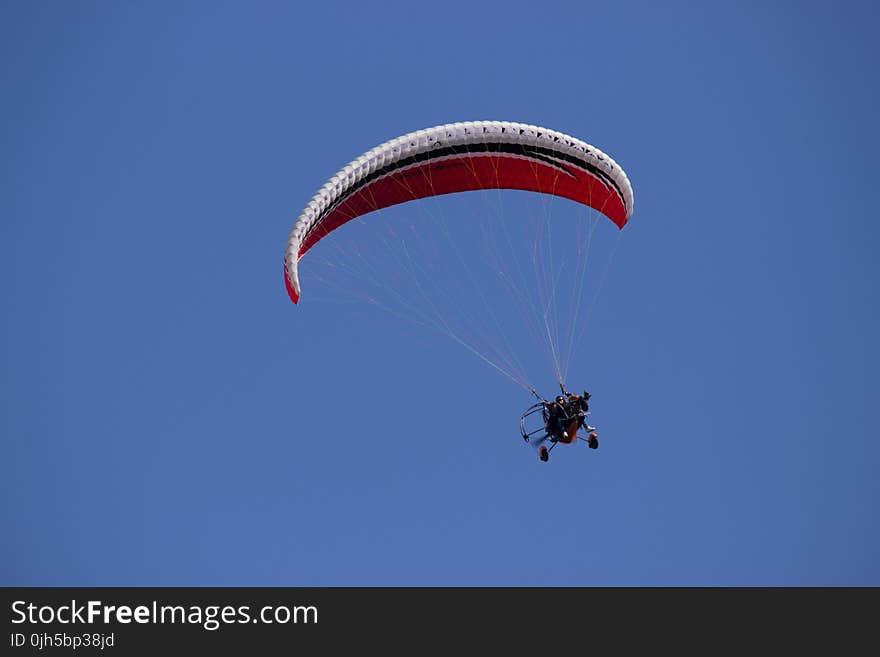 Person Paragliding during Daytime