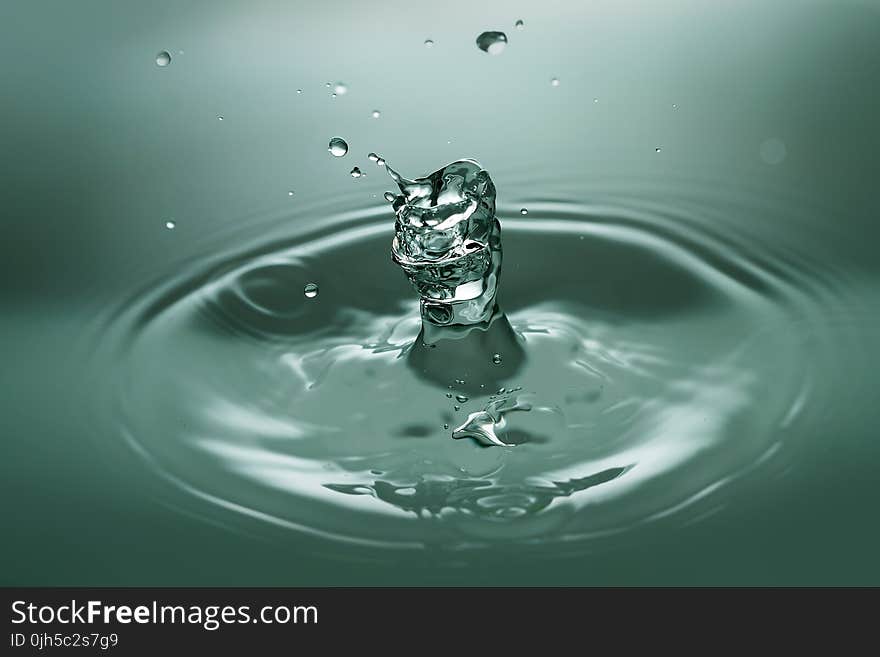 Close-up of Drop Splashing in Water