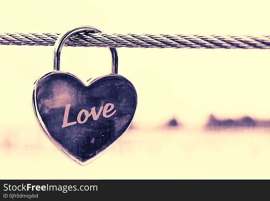 Close-up of Padlocks Hanging on Heart Shape