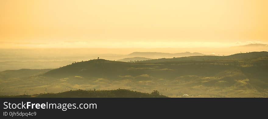 Scenic View of Mountains Against Dramatic Sky