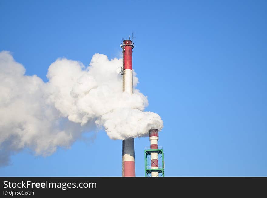 Smoke Stacks Against Blue Sky