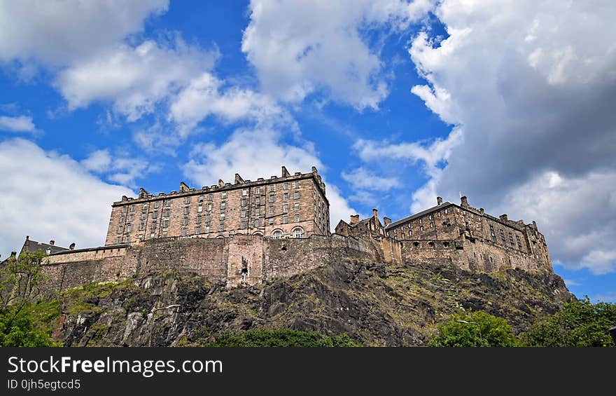 Low Angle View of Fort Against Cloudy Sky