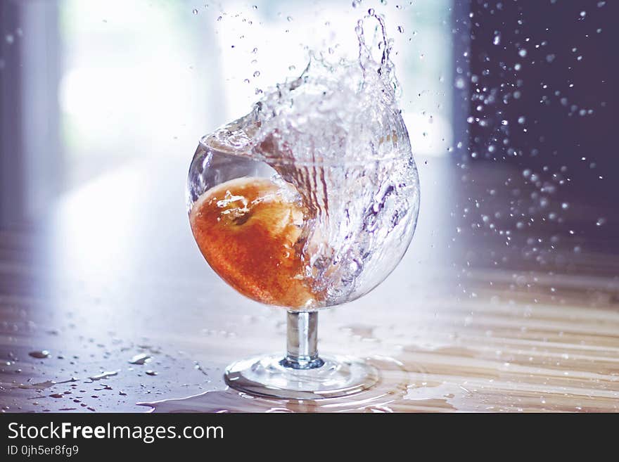 Close-up of Water Splashing in Glass