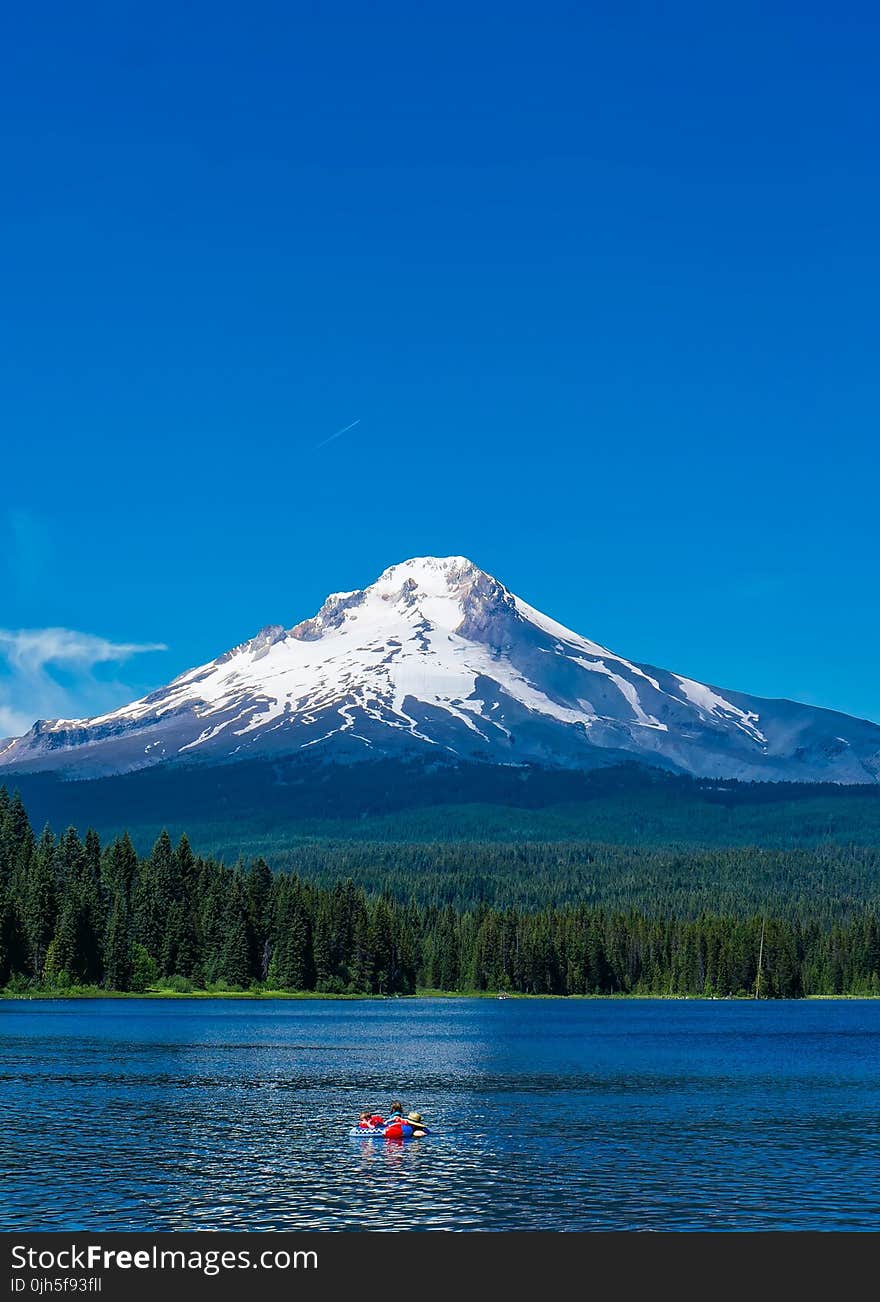 Scenic View of Lake Against Mountain Range