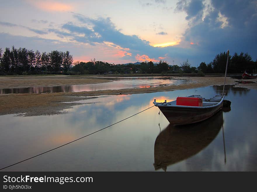 Scenic View of Lake Against Sky at Sunset