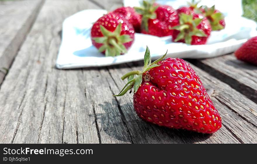 Strawberries on Top of Brown Table