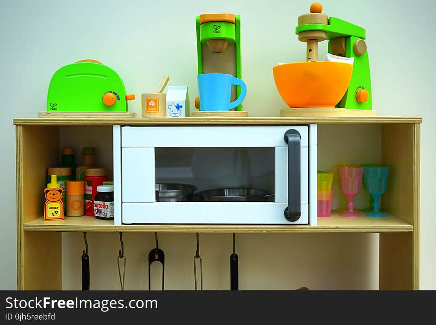 White Oven in Brown Wooden Rack