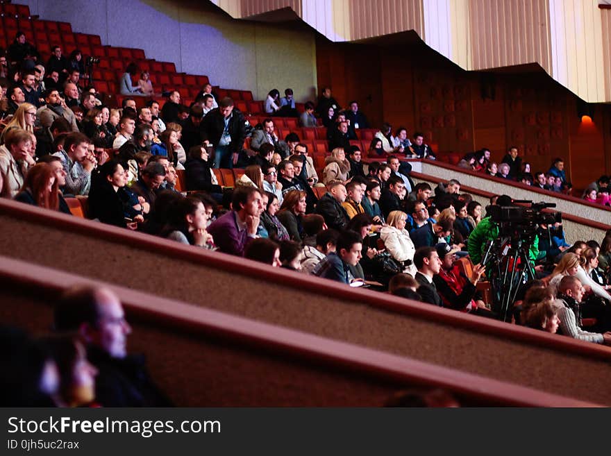 People Sitting Watching In The Theater